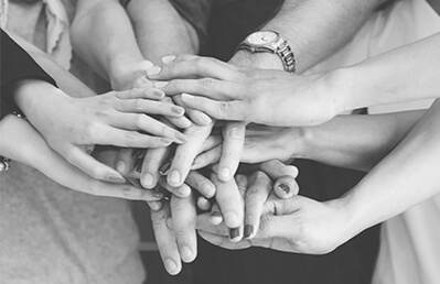 people hands coming together in a circle